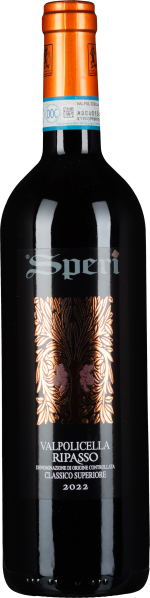Flasche mit elegantem Etikett in Schwarz und Kupfer, verziert mit symmetrischem, floralem Muster. Kräftige, orangefarbene Kapsel oben.