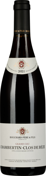 Eine elegante Weinflasche mit dunklem Glas, einer schlichten weißen Etikettierung und einem Wappen. Die Kapsel ist in tiefem Schwarz gehalten.