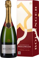 Eine elegante Champagnerflasche mit grünem Glas, goldener Halsfolie und schwarzem Etikett mit rotem Akzent. Daneben eine stilvolle, rot-weiße Geschenkbox mit goldenen grafischen Elementen.