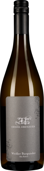 Transparente Weinflasche mit schwarzem Drehverschluss und elegantem, grauem Etikett mit floralen Verzierungen.